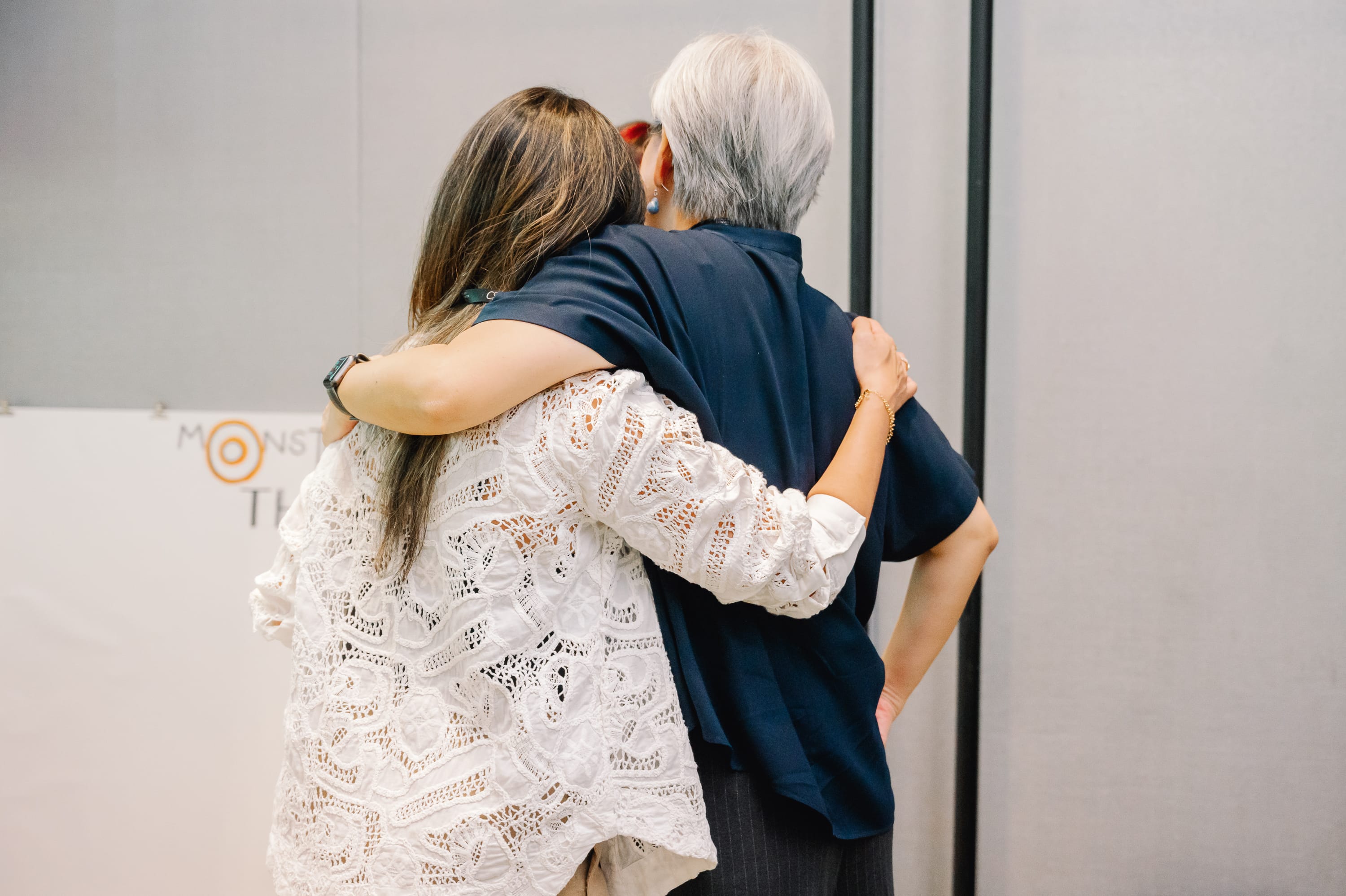 2 people hugging each other